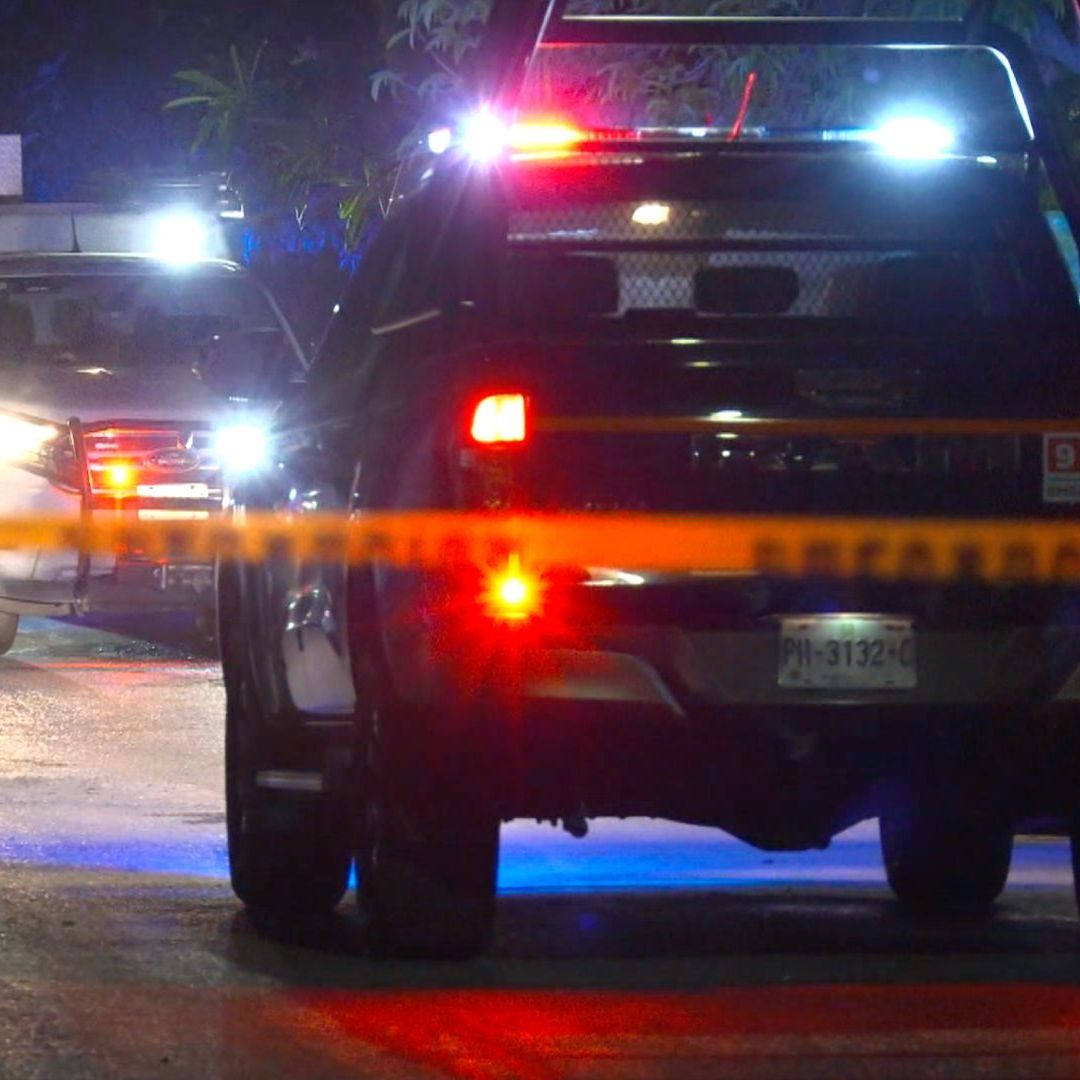Patrulla de la Policía de Juárez y zona acordonada por homicidio